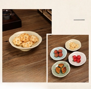 Detail of petal-shaped ceramic plates with crackle glaze for fruit and snacks