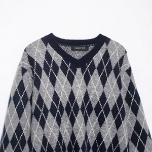 Classic argyle V-neck knit sweater in grey and black with soft wool texture