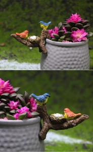 Garden bird ornaments for flower pots showing realistic resin bird nesting on pot rim