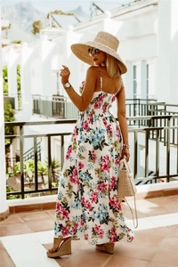 Detail of bohemian floral maxi dress with back smocking and straps in resort style