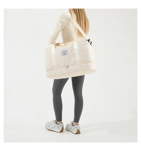 Detail showing stars quilted fabric fitness bag with separate bottom shoe compartment