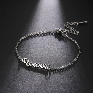 Silver stainless steel bracelet featuring hollow paw prints with adjustable chain links