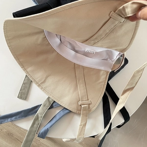 Detail of 100% cotton sun hats inner lining with strap attachments and sweatband