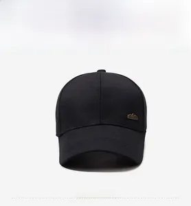 Front view of black cotton baseball cap with a gold mountain logo on the side
