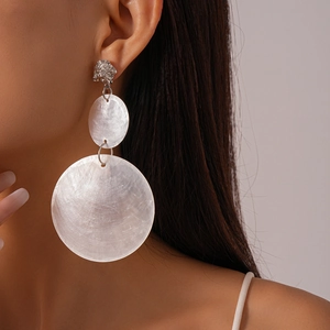 Exaggerated shell hoop earring featuring a silver lion head metal accent and white texture