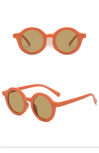 Close-up of orange round kids sunglasses with vintage brown lenses in front and side views