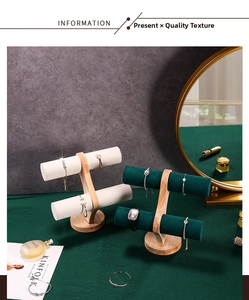 Close-up of dual-layer wooden T-bar jewelry display stands with velvet rolls