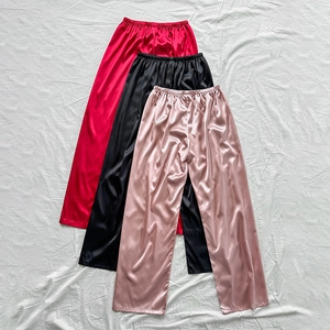 Lustrous satin straight-leg lounge pants in red, black, and champagne pink colors