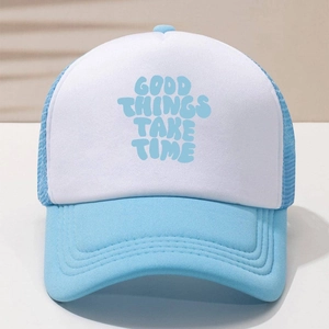 Close-up of blue and white trucker hat with 'GOOD THINGS TAKE TIME' text and mesh detail