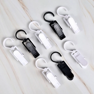 Macro view of multi-purpose rotating hooks and plastic clips for hanging socks and gloves