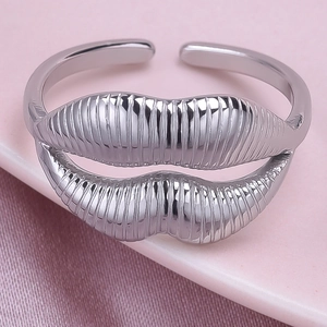 Macro shot of silver lip-shaped 304 stainless steel adjustable open ring with vertical texture