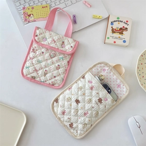 Flat lay of quilted cotton phone bags with cute animal prints and soft pink lining