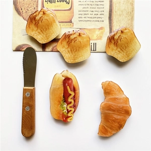 Top-view of realistic bread phone sockets with vintage magazine and a spreader tool