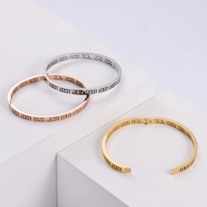 Hollow Greek key bangle bracelets in silver, rose gold, and gold plating with snap closure