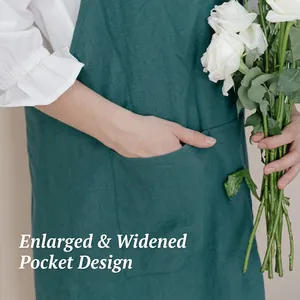 Simple dark green linen apron with wide straps and large pockets for kitchen use