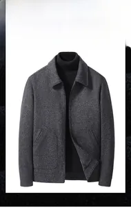 Close-up of grey wool blend jacket with classic lapel collar and textured fabric detail
