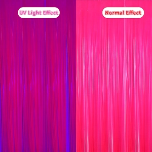 Neon rose pink tinsel curtain showing UV glow effect versus normal light comparison