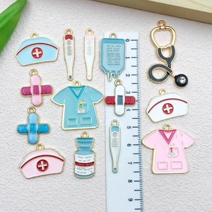 Nurse medical alloy pendants set with stethoscope and hat charms beside a ruler