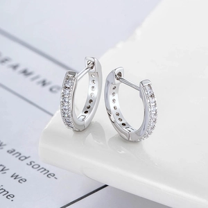 Minimalist copper hoop earrings with inlaid cubic zirconia pavé in a silver finish