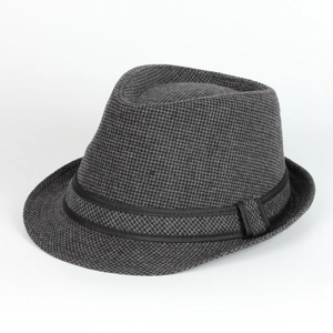 Detail of British style fedora hat showing grey houndstooth wool fabric and black ribbon