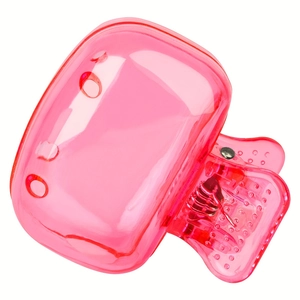 Close-up of pink translucent hair claw clip showing internal spring and anti-slip teeth
