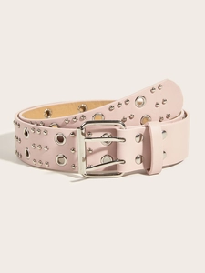 Detail of pink punk leather belt featuring double row silver eyelets and metal buckle