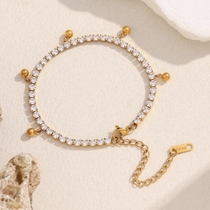 18K gold plated stainless steel bracelet with zircon beads and tassel charms