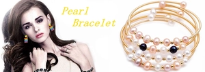 Detail of layered gold wire bracelet set featuring multi-colored natural freshwater pearls