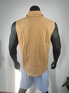 Detail view of khaki sleeveless linen shirt back showing high collar and textured fabric