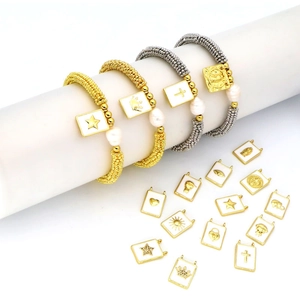 Close-up of Bohemian stretch bracelets with freshwater pearls and enamel charms