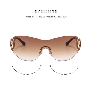 Detail of Y2K rimless sunglasses with brown gradient lenses and golden hinge decor