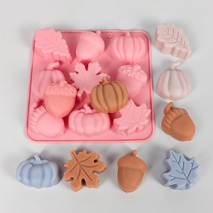Detailed pink silicone mold featuring leaf, pumpkin, and acorn shapes for DIY autumn cakes