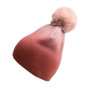 Detail of pink tie-dye gradient knit hat featuring a fluffy faux fur pom-pom on top
