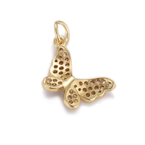 Detailed view of a gold butterfly pendant with hollow-out back and white zircon accents