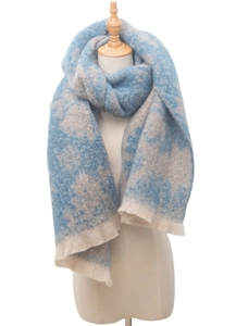 Detailed view of blue and beige jacquard scarf with wool blend texture and fringe