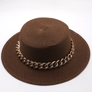 Detail of coffee brown boater straw hat with stylish gold chain band and flat brim