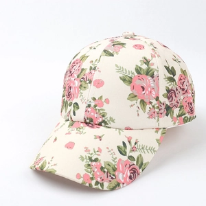 Close-up of beige baseball cap with elegant pink rose floral print and leaf details