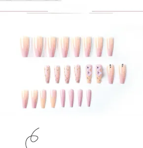 Detail view of purple gradient press-on nails with 3D floral accents and gold foil