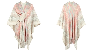 Detail of colorful striped knit shawl featuring faux fur collar and decorative pom-poms