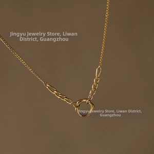 Detail shot of 18K gold plated titanium chunky chain necklace with irregular ring pendant