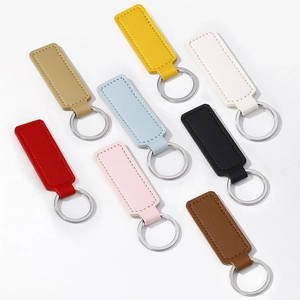 Minimalist PU leather business car keychains in eight assorted colors on white background
