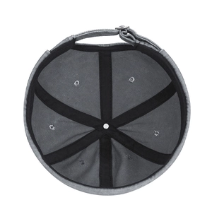 Deep grey vintage docker cap interior showing six-panel stitching and metal buckle