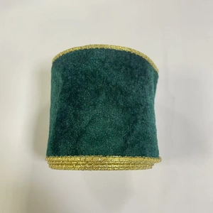 Detail of dark green velvet ribbon with gold metallic edges for Christmas tree decor