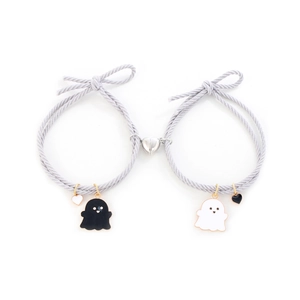Close-up of heart-shaped magnetic clasp connecting two gray ghost charm bracelets