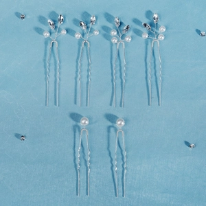 Detailed set of 6 bridal hair pins with pearls and rhinestones on a blue textured base