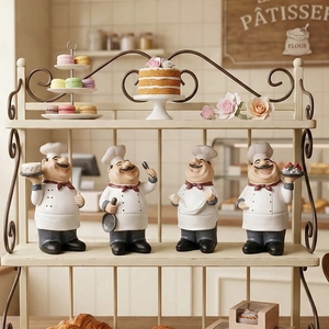 Set of four resin chef figurines for bakery and kitchen decor on a display rack
