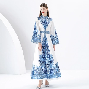 Elegant white maxi dress with blue baroque floral print, high neck and flare sleeves