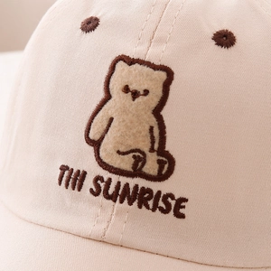 Kids baseball cap featuring embroidered bear patch and THI SUNRISE lettering