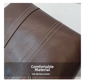 Detailed macro view of the brown leather texture and decorative white double stitching