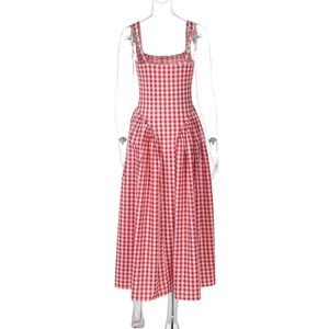 Detail of red checkered maxi dress featuring an open back and pleated waist detail